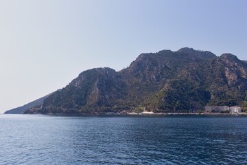 A scenic view of an island with mountains and part of city in Icmeler - Marmaris - Mugla - Turkey