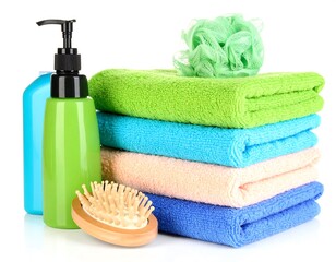 Colorful towels neatly stacked with toiletries on a clean white backdrop