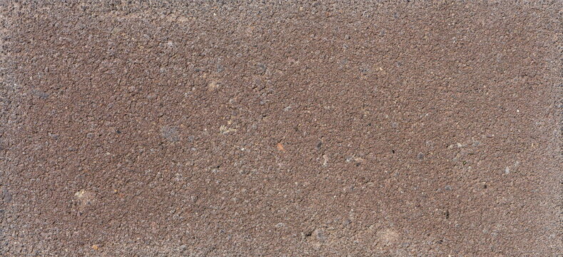 The texture of the brick is coarsely enlarged