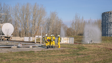 A group of rescuers equipped with breathing apparatus at the scene of an accident at a...