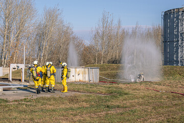 A group of rescuers equipped with breathing apparatus at the scene of an accident at a...