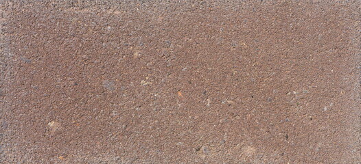 The texture of the brick is coarsely enlarged