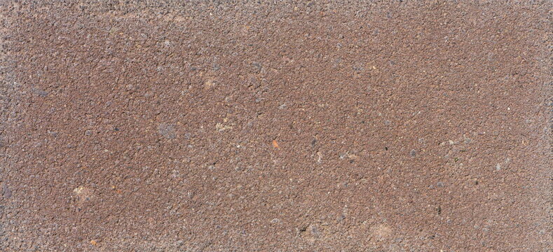The texture of the brick is coarsely enlarged