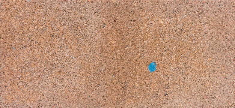 The texture of the brick is coarsely enlarged