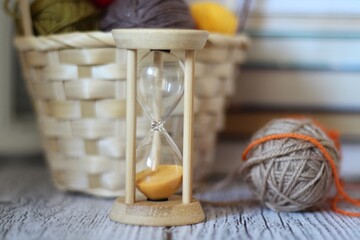Hourglass balls clews of yarn wool handmade hobby and timer books cozy photo 