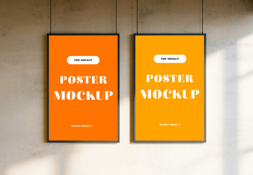 Two Vertical Poster Mockups Hanging On Wall