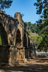 An ancient aqueduct in the ruins of the city of Phaselis in Lycia in modern Turkey.