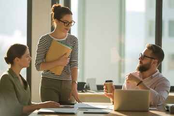 Energetic team collaborates on project, discussing ideas and planning strategy in bright modern office environment