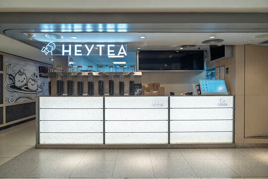 Penang, Malaysia &ndash; Aug 15, 2025: A clean, minimalistic HEYTEA outlet counter in a mall, with tea ingredients on display and a digital ordering system.