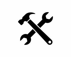 Hammer and wrench silhouette crossed tools isolated on white background