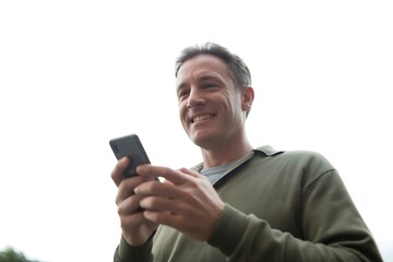 Smiling man using smartphone, connecting with friends or accessing information, technology lifestyle