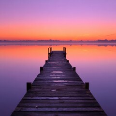 Fototapeta premium Serene sunrise over calm lake, wooden pier extends to misty horizon, peaceful morning scene, ideal for travel brochures