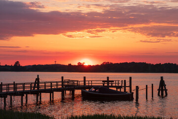 Romantic sunset over the Schlei fjord with jetty.