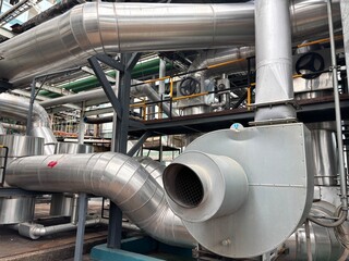 The image shows two parallel industrial pumps with blue bodies and yellow motors. A complex network...