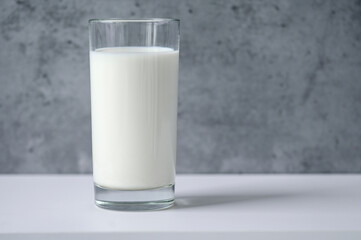 Close-up of glass with milk on table