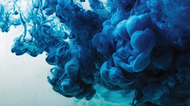 Vibrant blue ink swirling in water.
