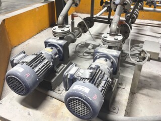 Twin industrial pumps and motors, marked 'A' and 'B', working in tandem. This image highlights the...