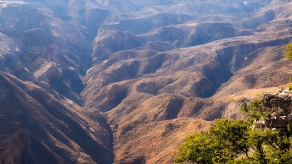Panoramic summer mountain view with a scenic canyon landscape and clouds