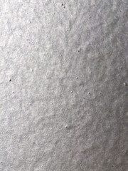 Macro texture of rough grey paper surface with natural fibrous detail