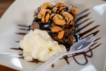 Decadent Chocolate Cake with Nuts and Cream