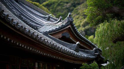 A detailed view of a traditional japanese roof with green foliage in the background