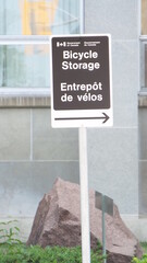 The sign indicates the location of a Bicycle Storage area. The sign is bilingual, showing the text...