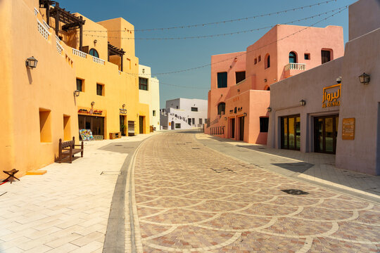 Doha, Qatar - 10 Aug, 2025: Colourful buildings in the old port area