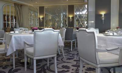 Formal and elegant a la carte ocean view dining room restaurant onboard luxury cruiseship or cruise...
