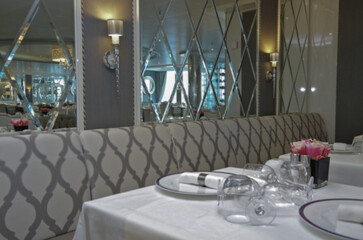 Formal and elegant a la carte ocean view dining room restaurant onboard luxury cruiseship or cruise...