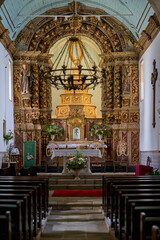 Ornate church interior with altar and decorations.