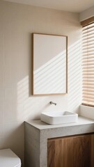 Fototapeta premium Empty vertical poster mockup with a wooden frame in a modern bathroom with a minimalist sink and concrete countertop