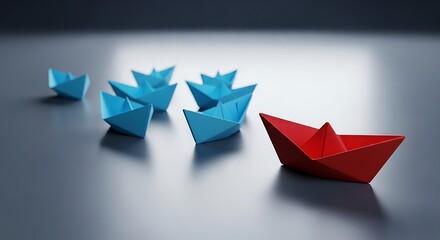 Leadership concept with red paper boat leading blue boats on the surface