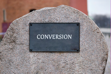 Copy space. Office, support and business concept. CONVERSION word written on the plaque of a large...