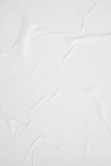 Obraz premium Wrinkled white paper texture suitable for backgrounds, overlays, scrapbooking, or digital art designs needing a distressed effect or aged look.