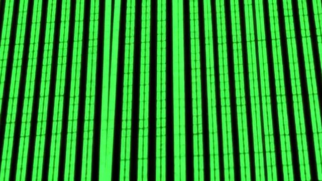 A neon green pattern of vertical lines with segmented sections against a dark background