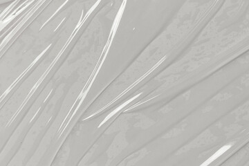Obraz premium Closeup view of crinkled translucent plastic wrap material suitable for packaging, sustainability, ecofriendly concepts, texture backgrounds, and abstract designs.