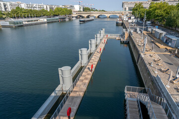 Paris, France - 08 15 2025: Panoramic view of empty Summer swimming in the Seine at Bercy quay