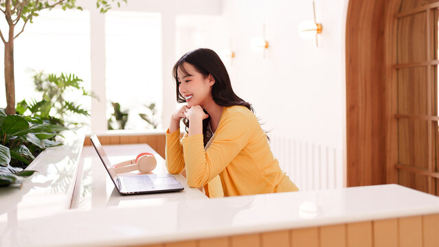Asian Adult Female Freelance Professional Work Modern Cafe Remote Business Strategy Online Productivity Laptop Computer User Happy Efficient Comfortable Setting
