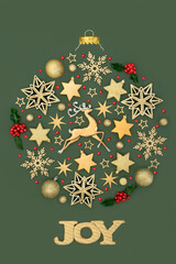 Joy at Christmas gold concept circle shape tree decoration, red holly berries, reindeer, star, snowflake baubles on green. Festive surreal design for Xmas.