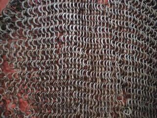 Chain mail texture. Old chain mail. Rusty texture of rings. Knights' clothing. Museum