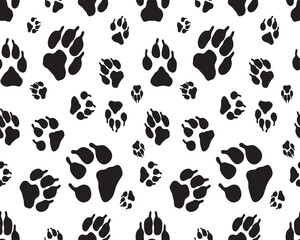 Black silhouettes of prints of dog paws, Seamless pattern	