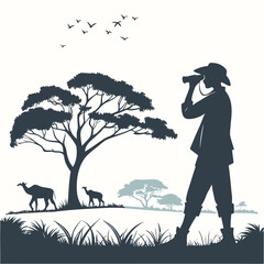 Silhouette of a safari tourist with binoculars in an African landscape