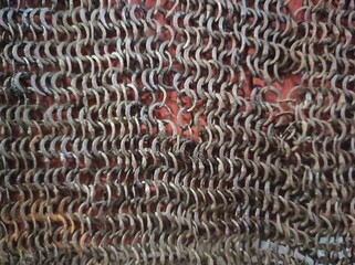 Chain mail texture. Old chain mail. Rusty texture of rings. Knights' clothing. Museum
