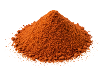 Close-up of a vibrant orange spice powder piled into a neat mound on a black background with