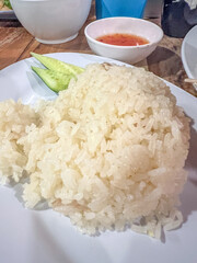 Delicious Sticky Rice Served with Slices of Cucumber