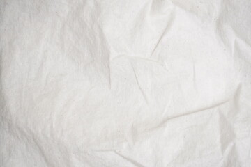 Textured white background with fine creases and subtle patterns