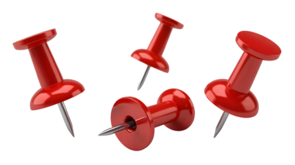 A close up shot of four red push pins scattered on a black background in a studio setting with lighting