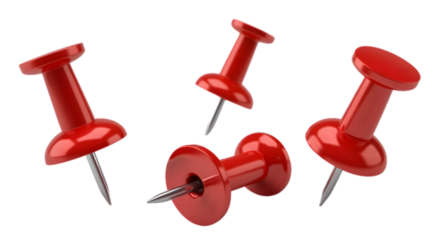 A close up shot of four red push pins scattered on a black background in a studio setting with lighting