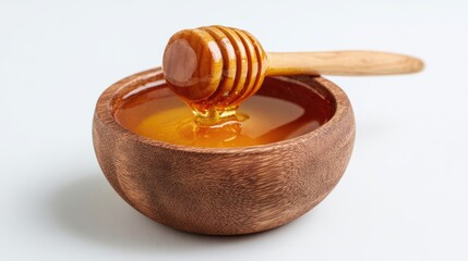 Honey pot and dipper on white background.