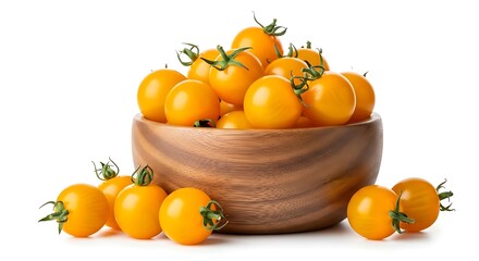 Fresh yellow cherry tomatoes piled high in a wooden bowl with scattered tomatoes